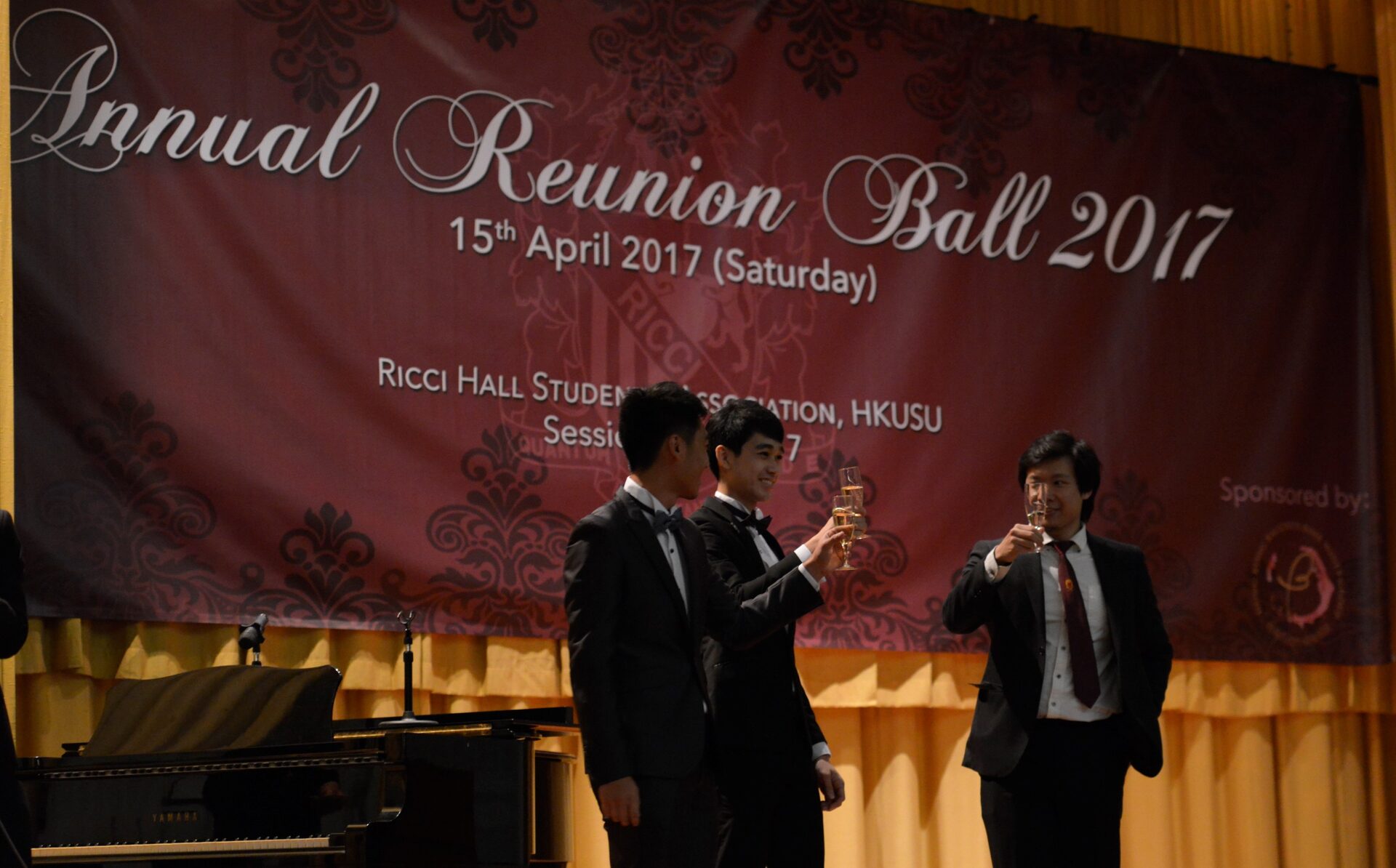 Riccians toasting on stage at the Annual Reunion Ball